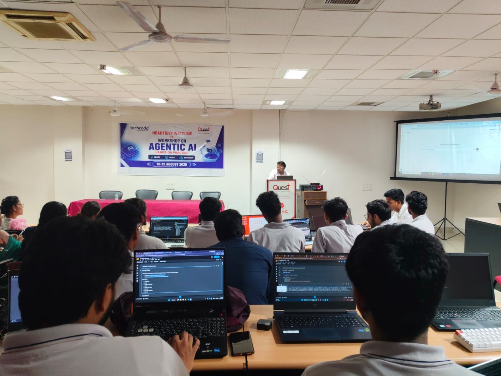 Workshop participants working through LangChain on their laptops